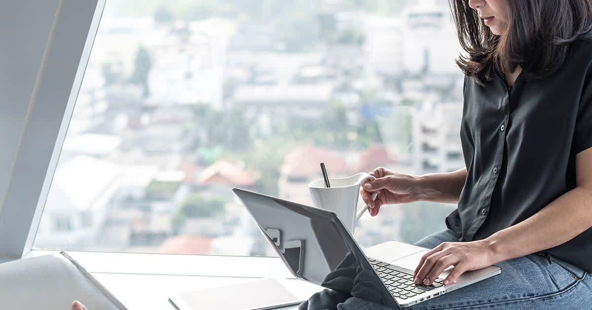 a woman doing online research on a laptop