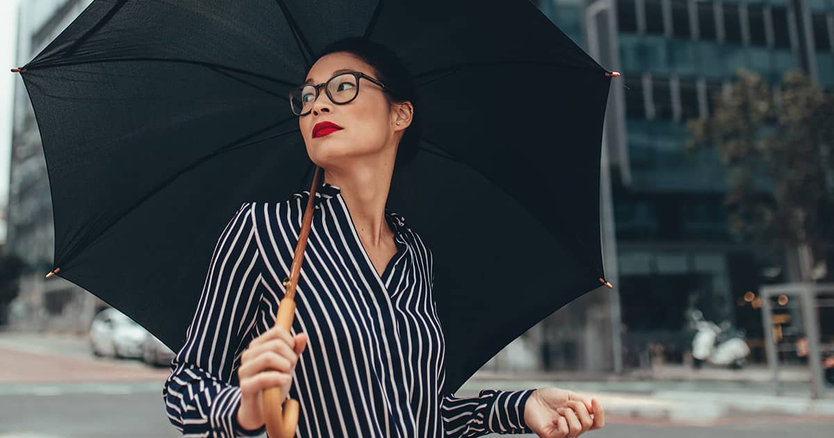 woman with an umbrella in a city