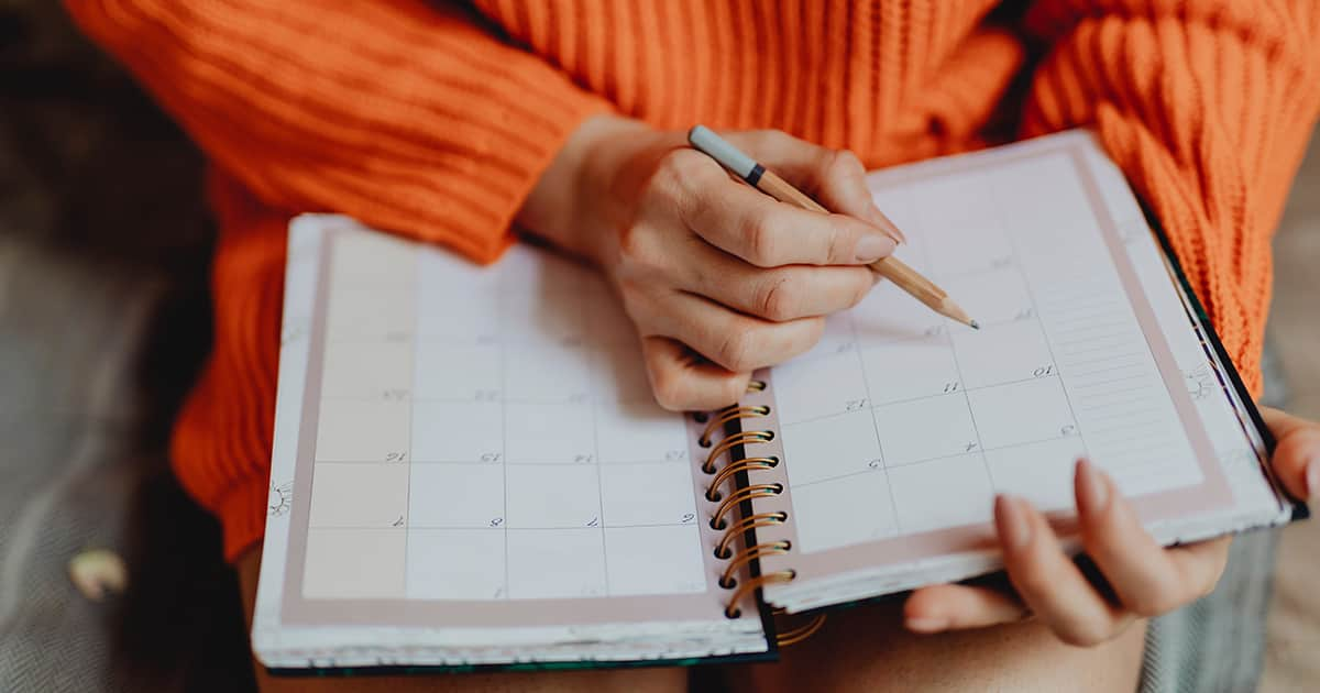 a woman writing in a diary