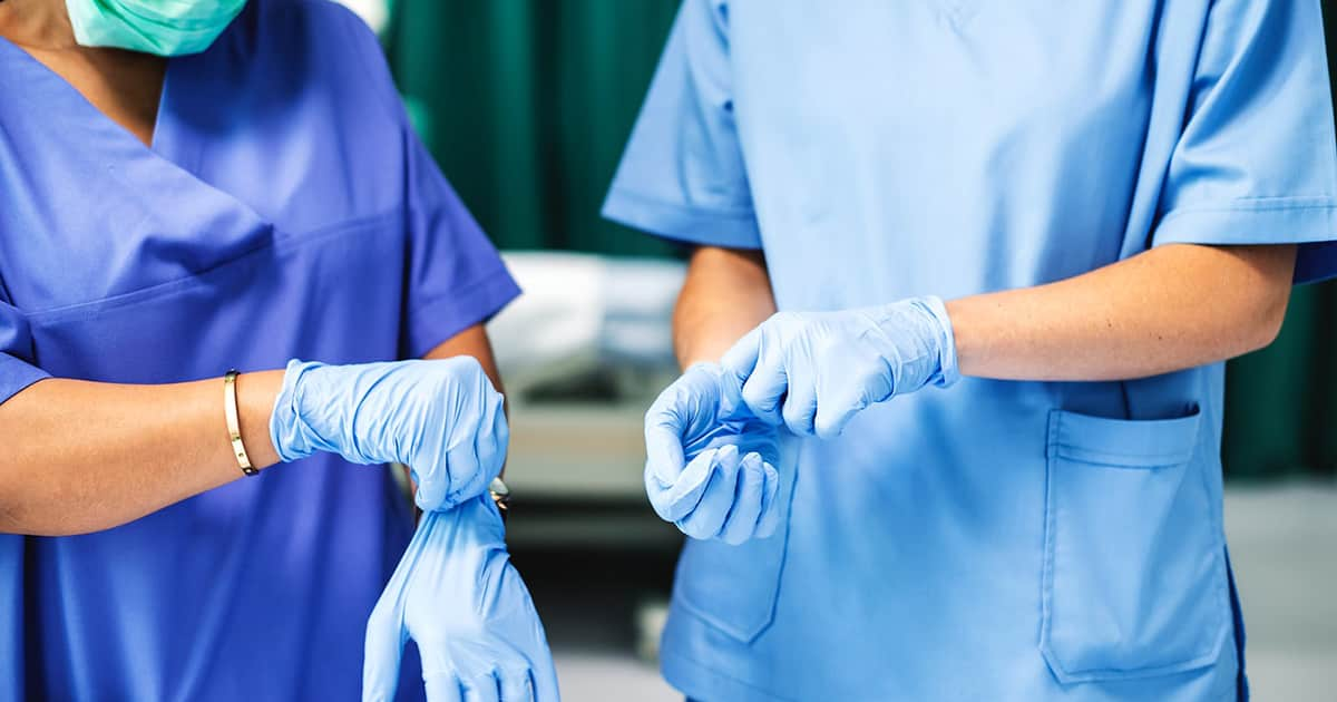 doctors putting on their gloves