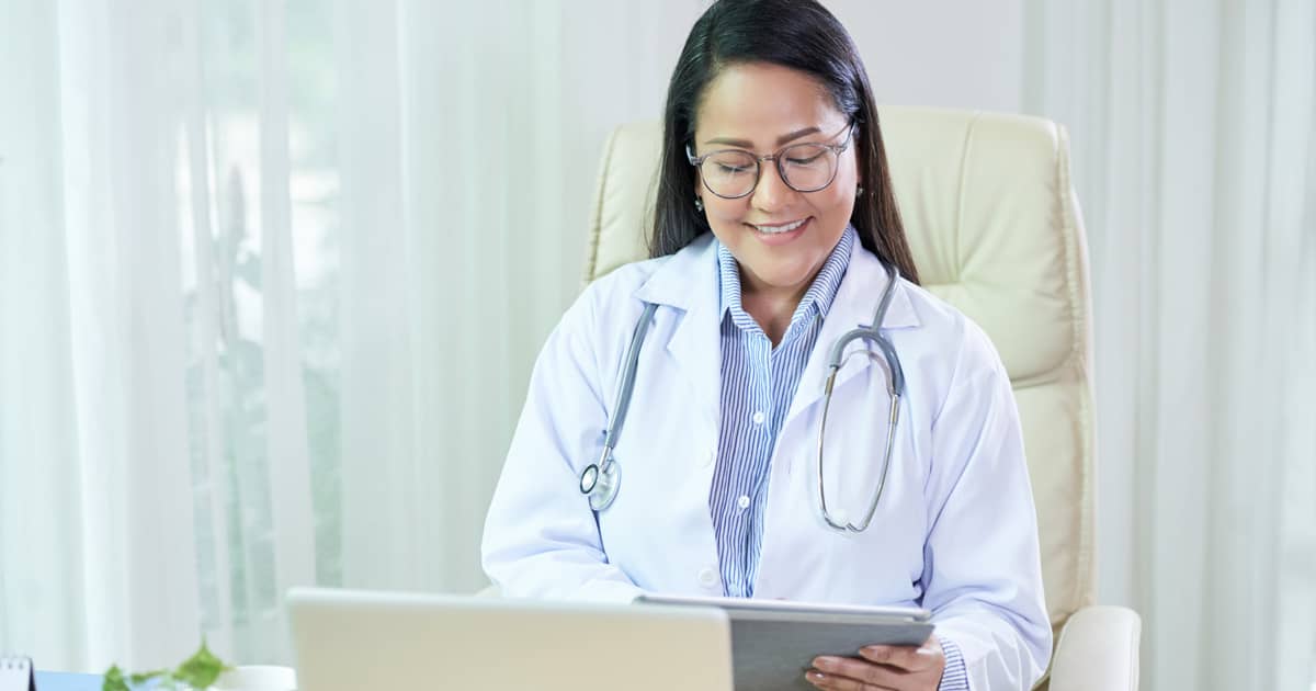 a female doctor on her laptop