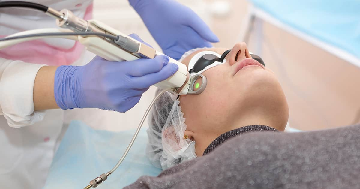 a woman receiving medical laser treatment