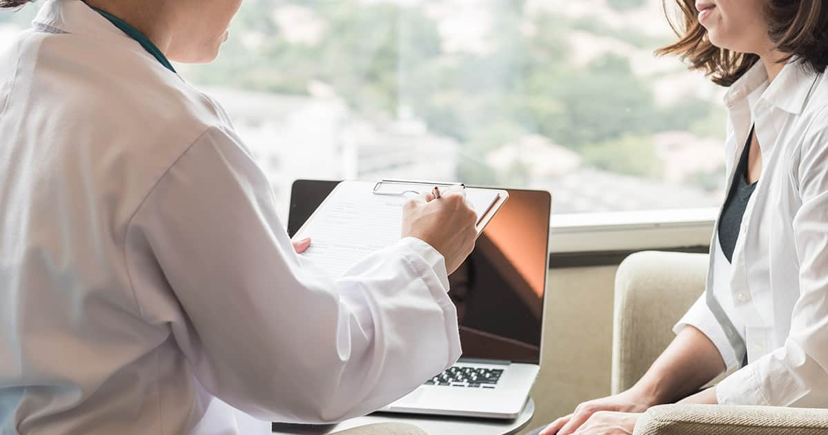 a doctor speaking to a patient