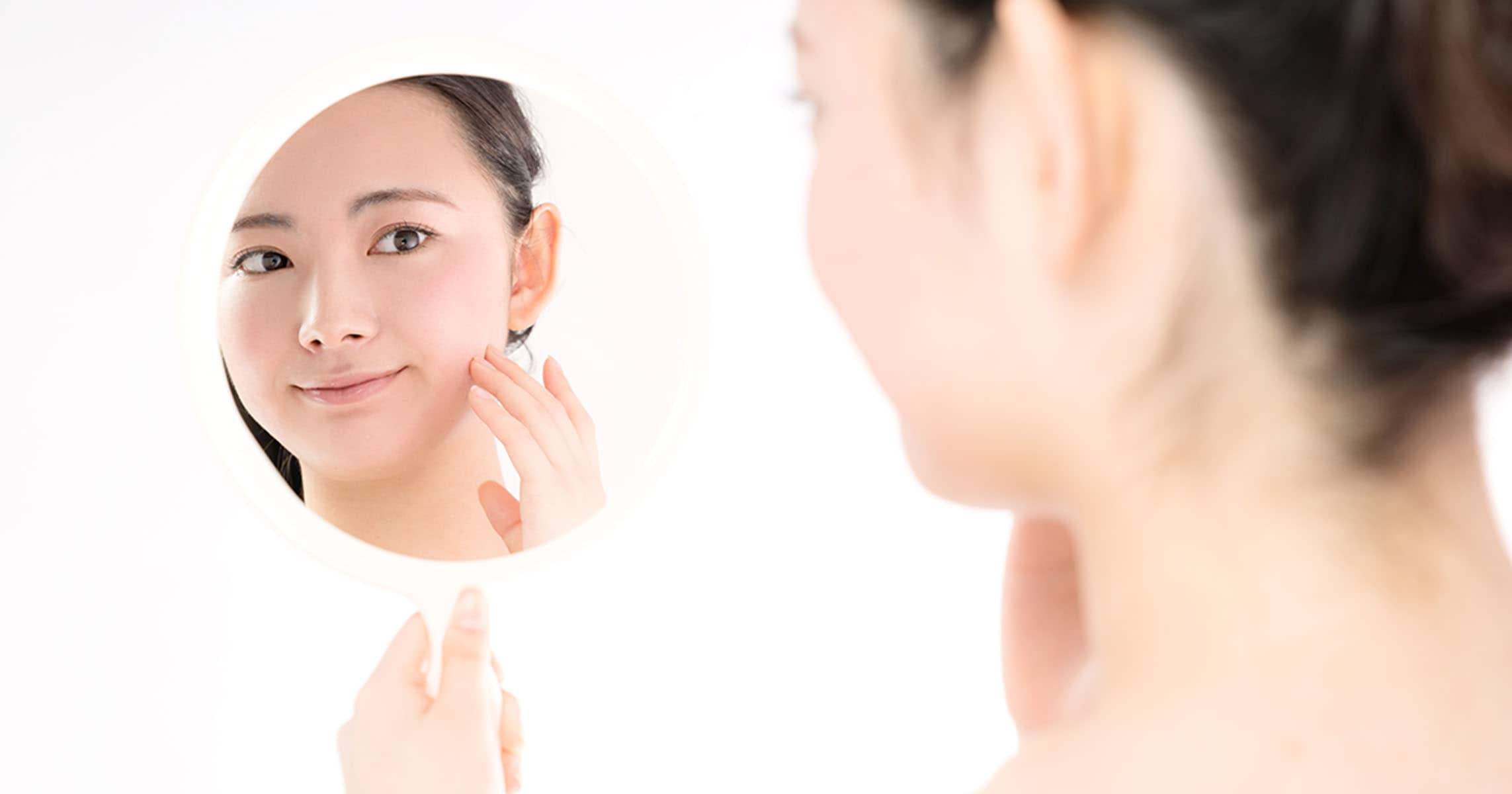 lady looking into mirror