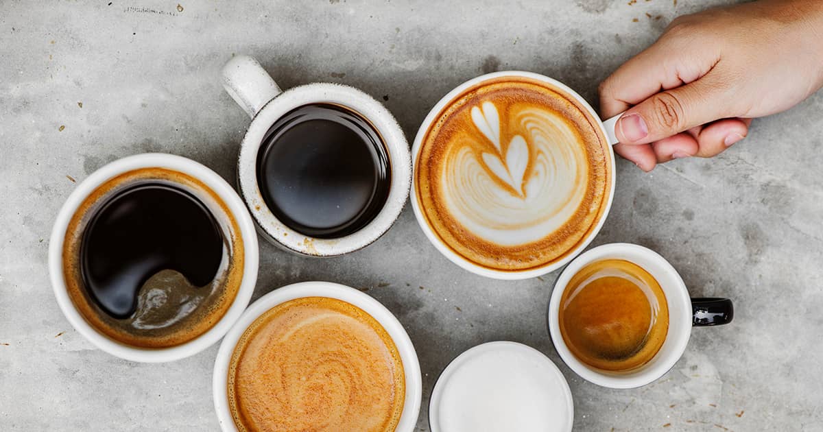 flatlay of cups of coffee and latte