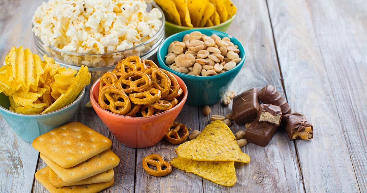 snacks and chocolates on a wooden-table