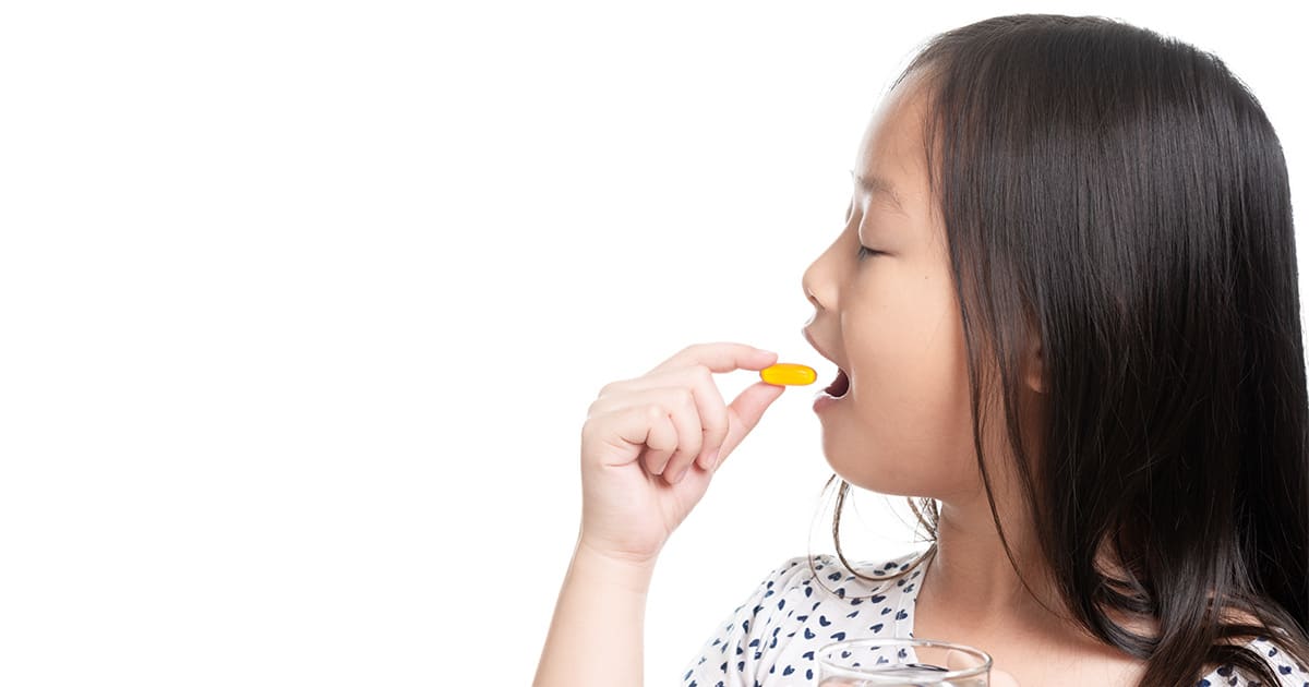 young-girl-taking-food-supplements