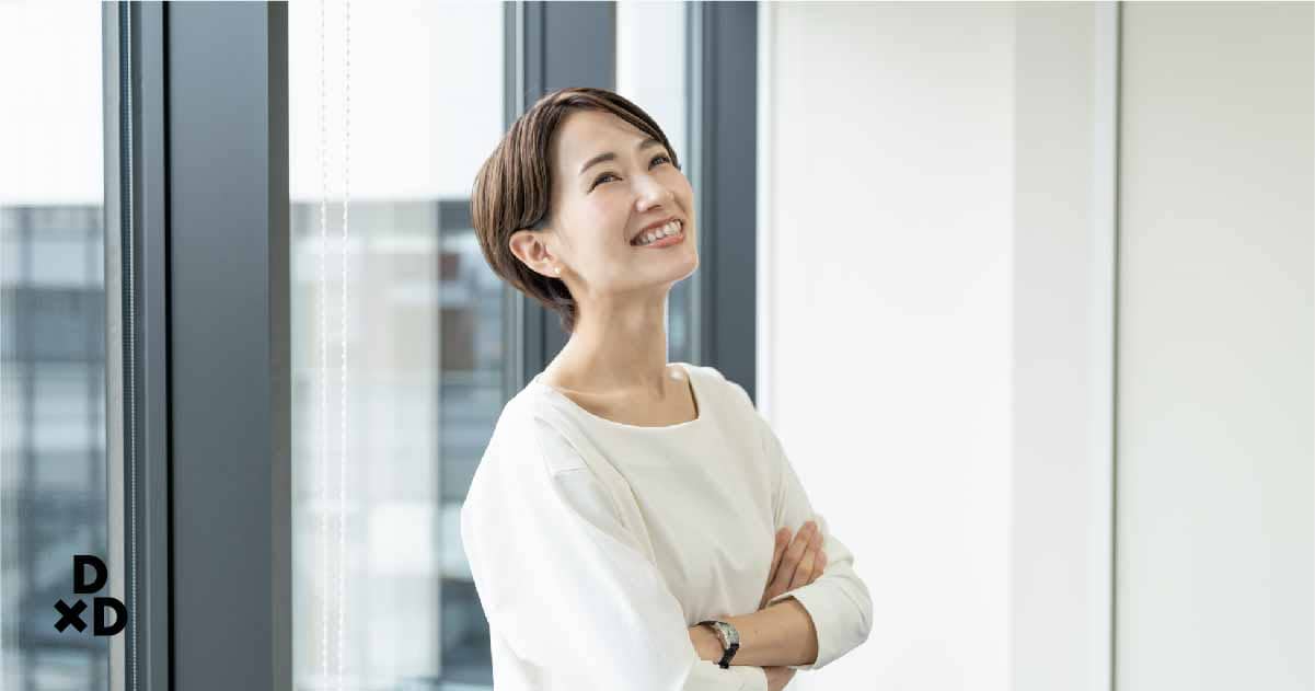 Woman smiling with arms folded