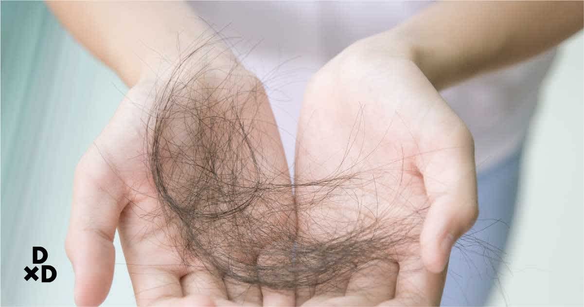 Tufts of hair held in hands