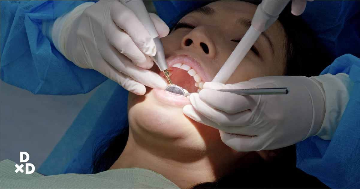 Woman getting mouth examined