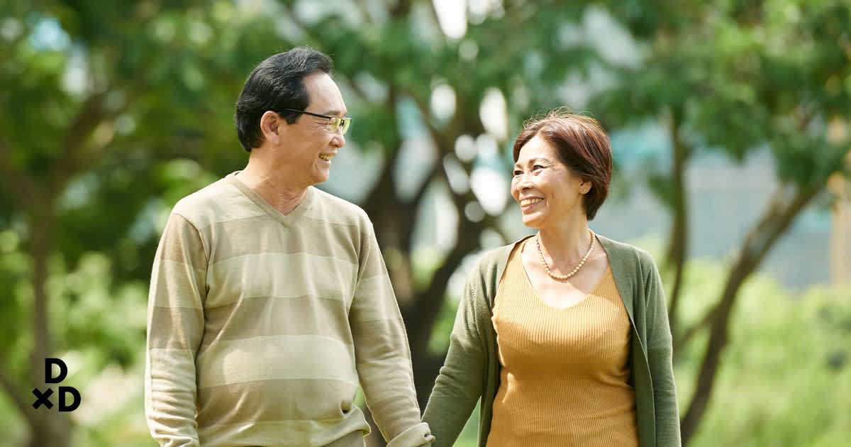 Elderly couple looking at each other lovingly