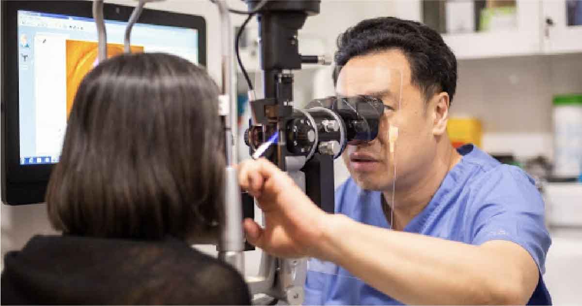 Dr David Goh performing eye examination for Glaucoma diagnosis