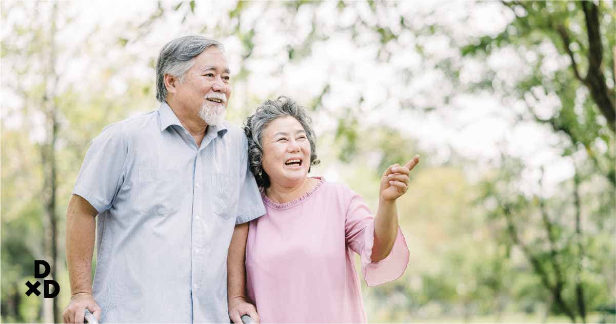 Seniors in the park enjoying a walk and the sights