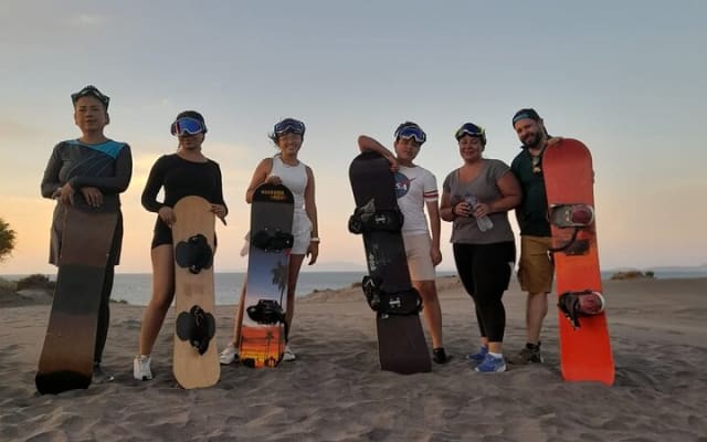 Sandboarding in the Mogote Sand Dunes in La Paz