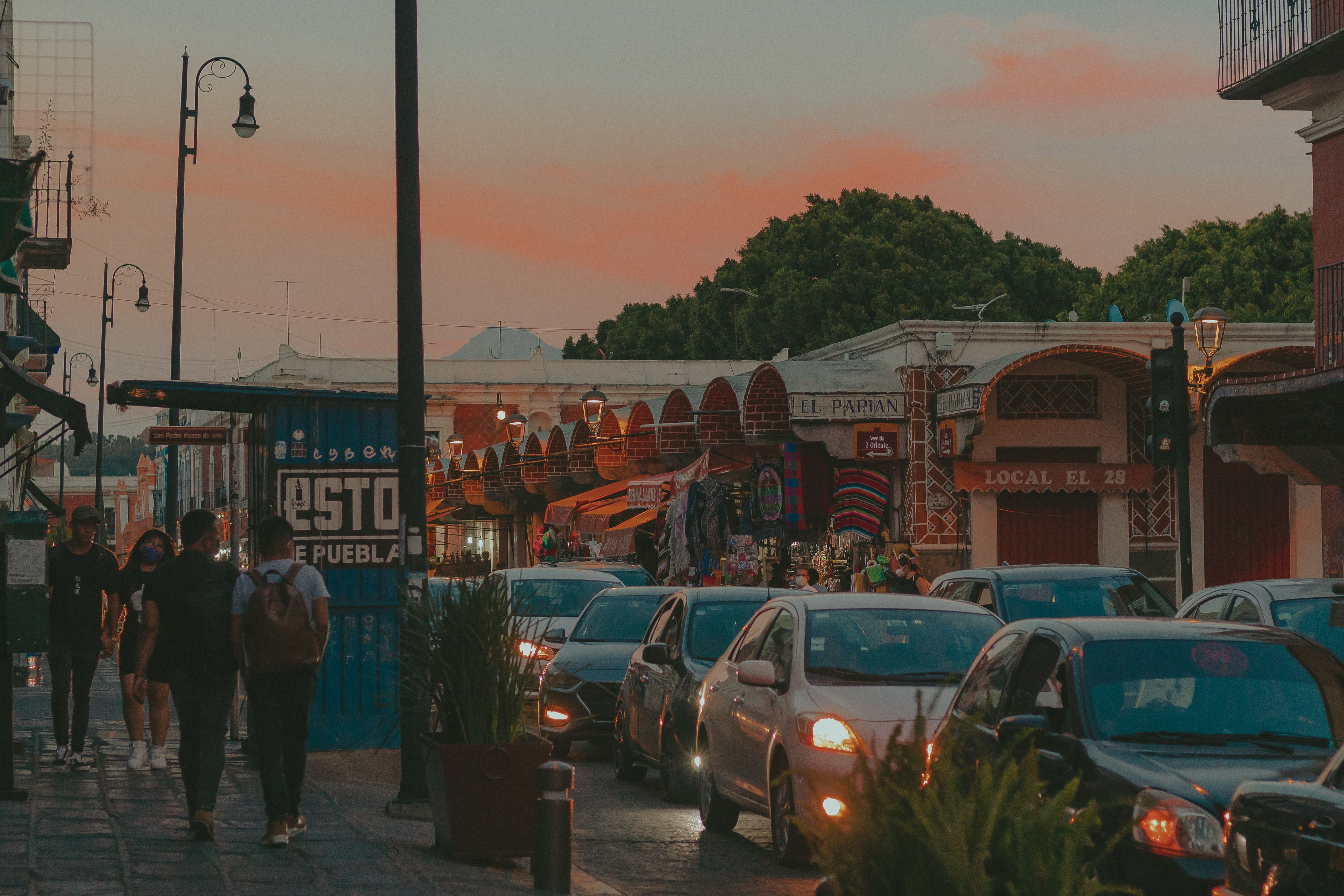 Tulum Pueblo main street at dusk with taco stands and local street life