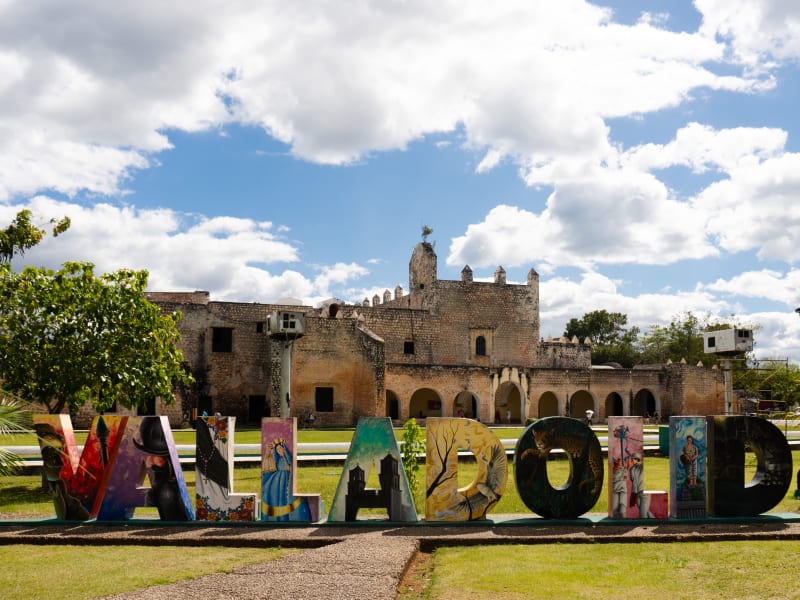 Colorful Valladolid town sign in front of a historic colonial church, Yucatán