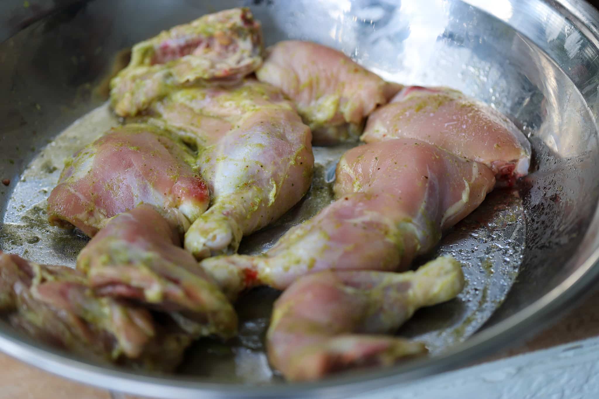 this is a photo of raw chicken with seasoning