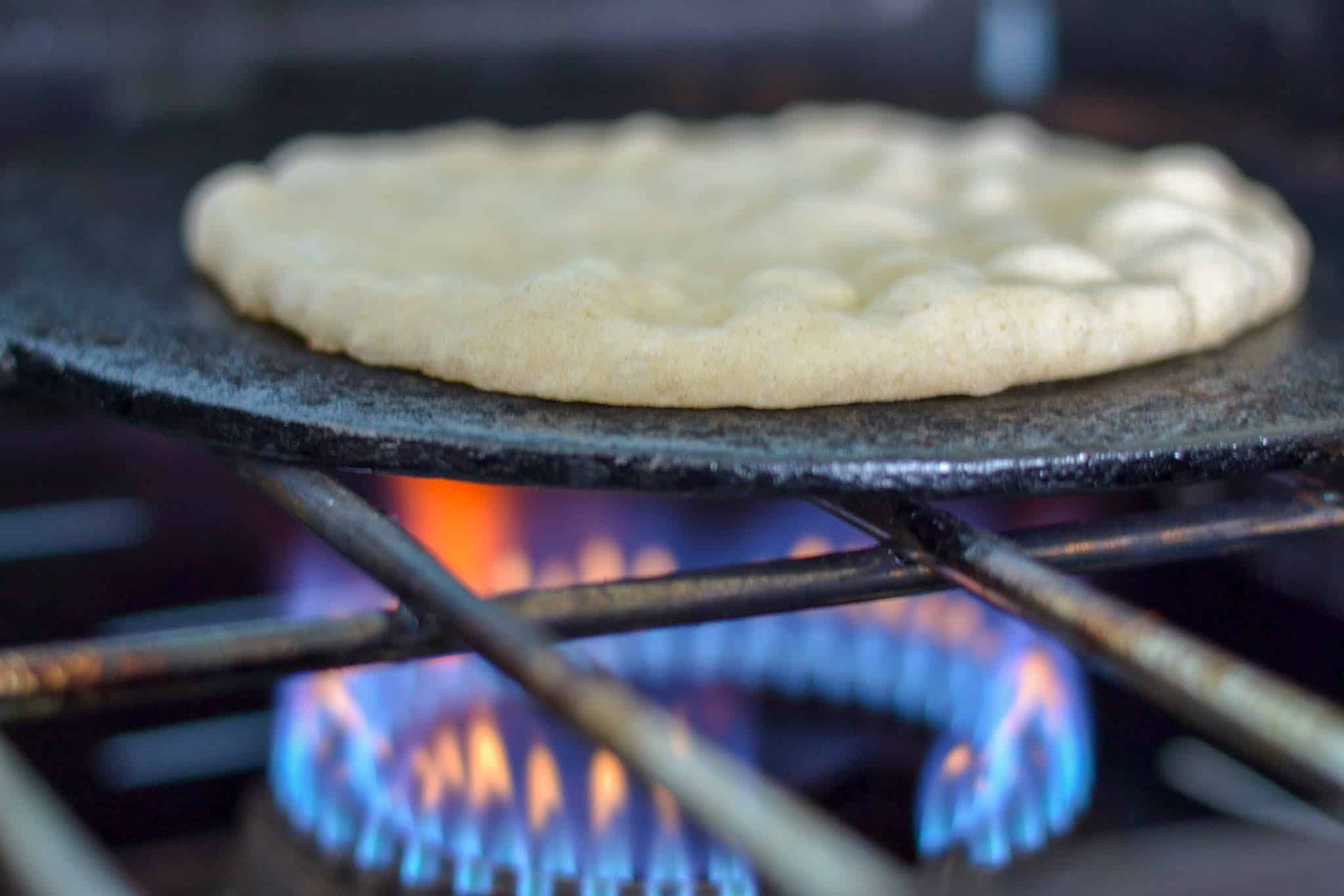 Sada roti bubbling up on tawa