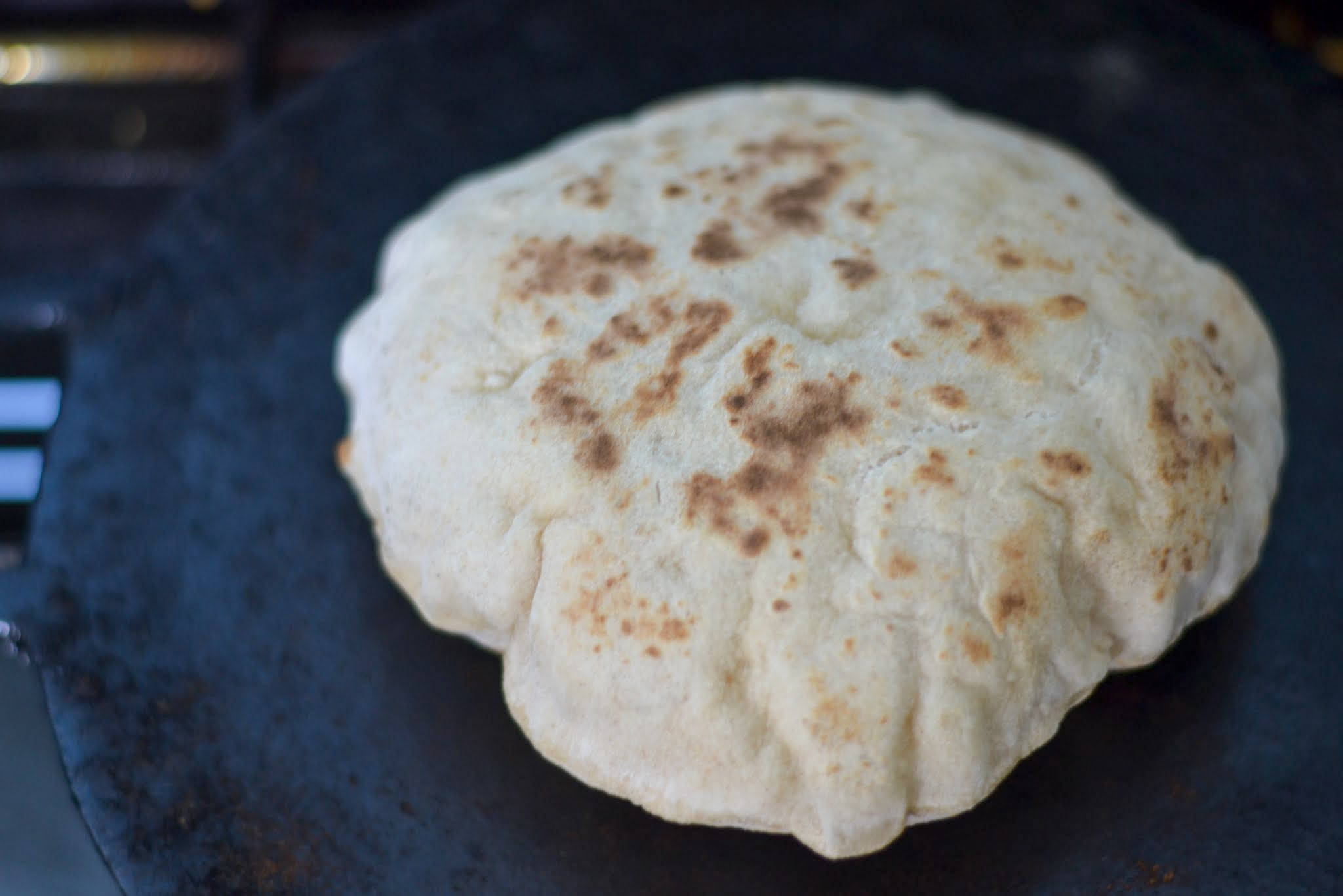 Sada roti on a black cast iron tawa
