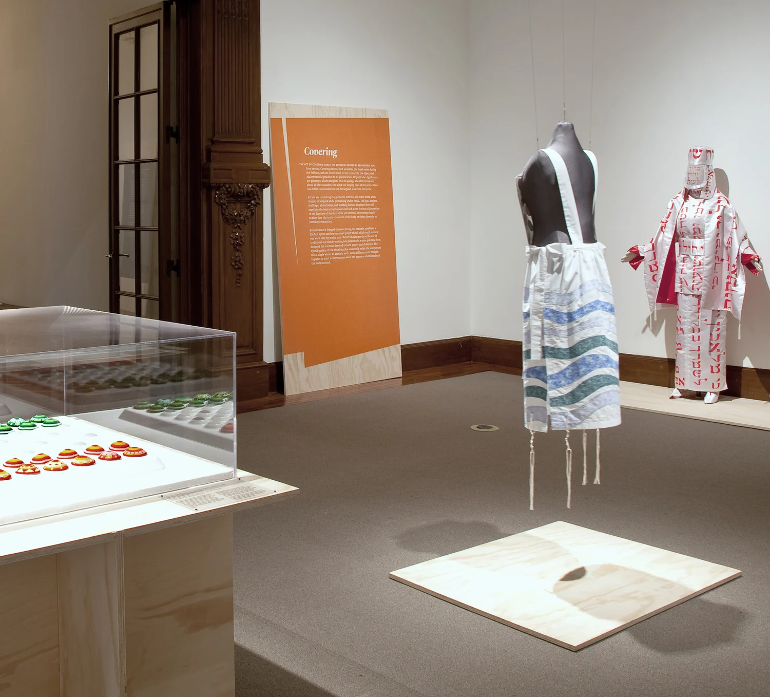 display, wood doorframe, text, religous clothing