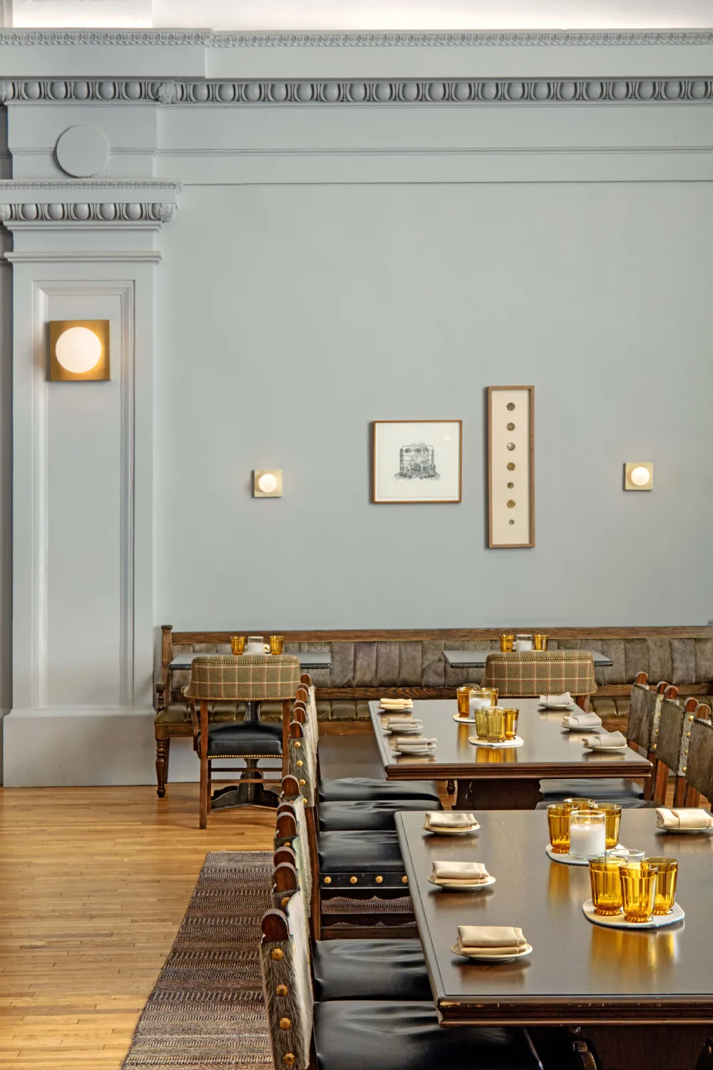 restaurant, tables, candles, art, wall molding, wall mounted lights