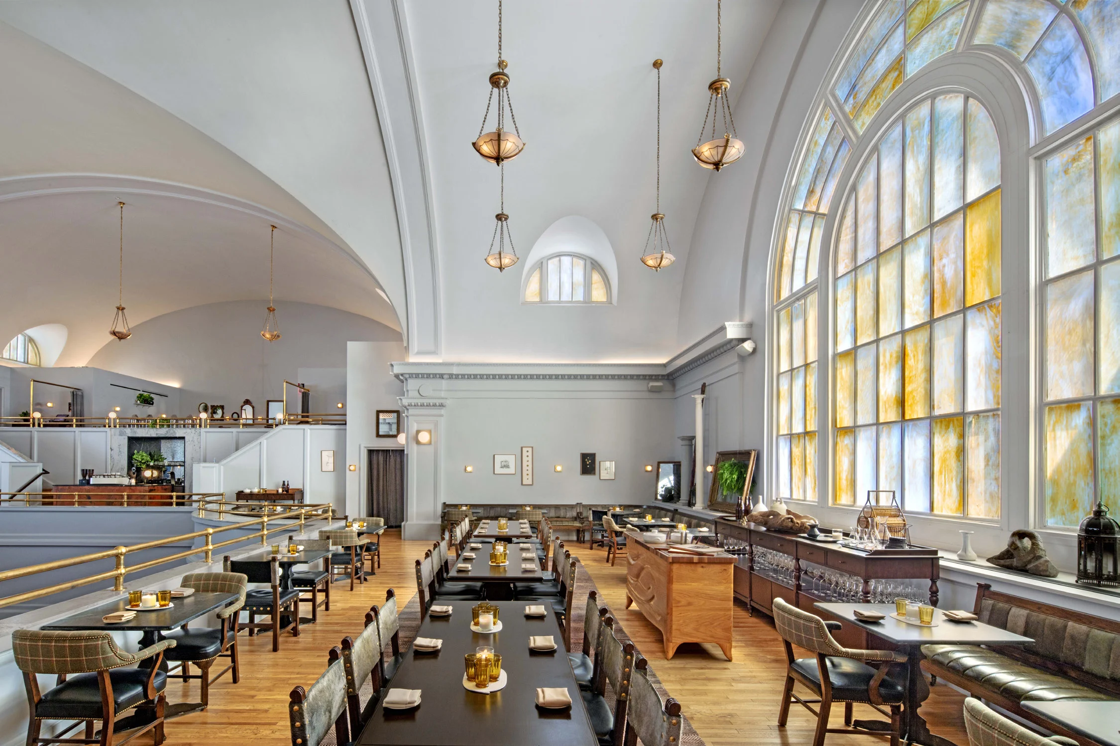 restaurant, tables, stained glass, arched ceiling, chairs, arched window, arche ceiling, pendant lights, mezzanine floor, wood flooring, stained glass