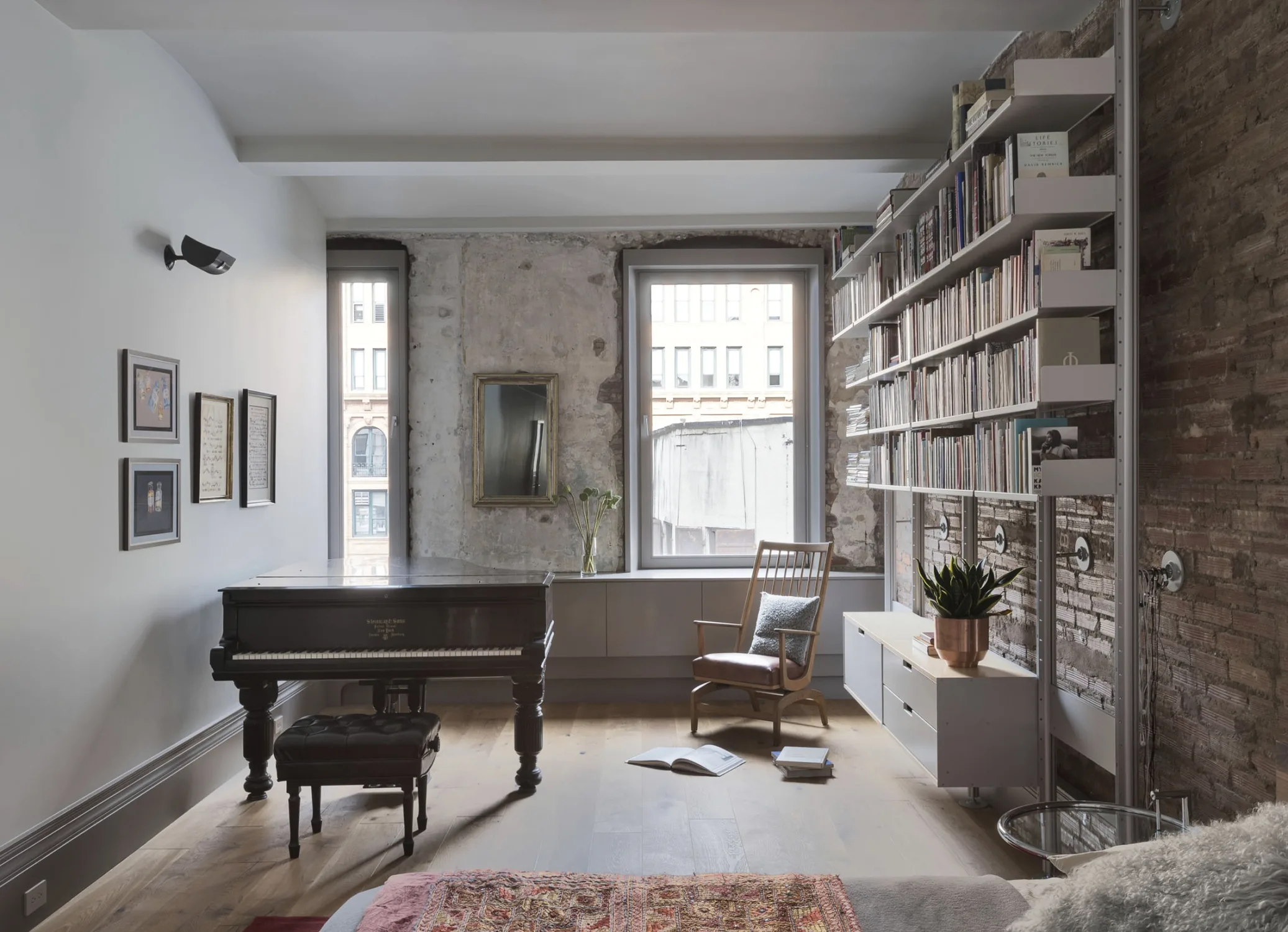 study, piano, bricks, bookshelf,art frames, concrete,bed,wood, mirror,plant