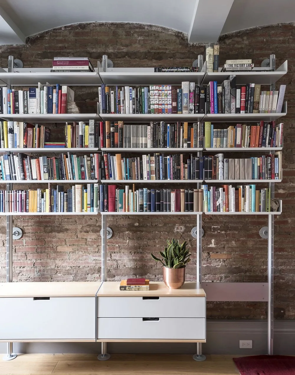 study, bookshelf, brick, arch,vanity,plant, books, wood,steel, carpet