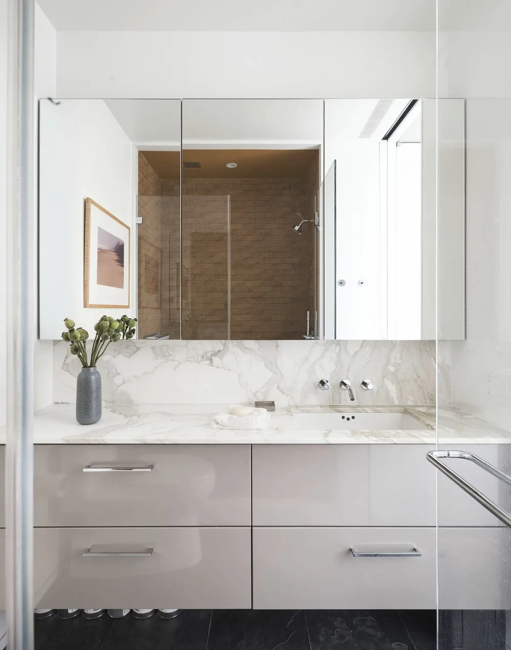 bathroom, sink, mirror, marble,vanity, glass, steel,art frame, brick, tiles