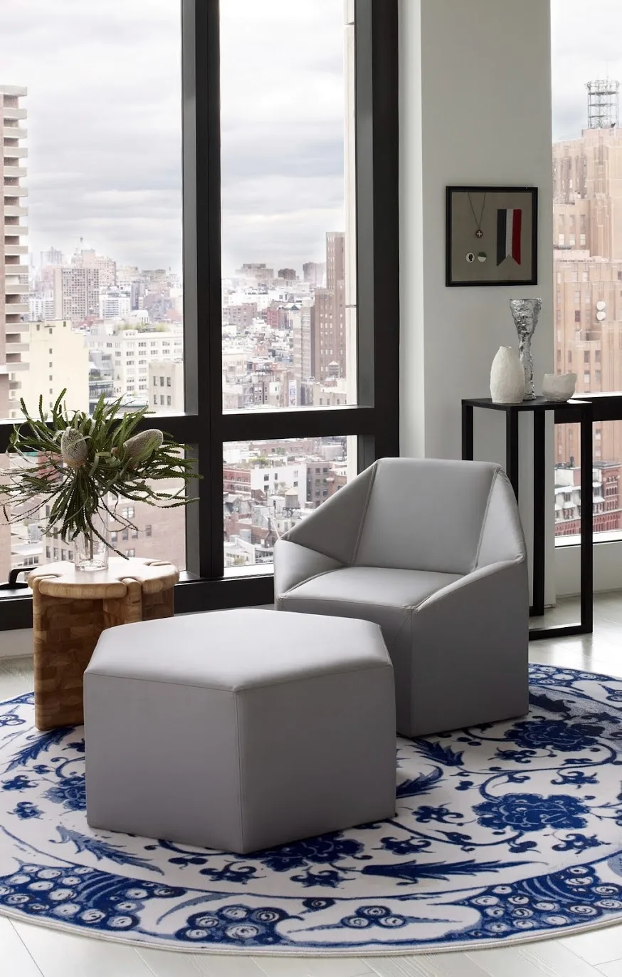 chair, leather, carpet, skyline, plant, side table, art, window, white, gray