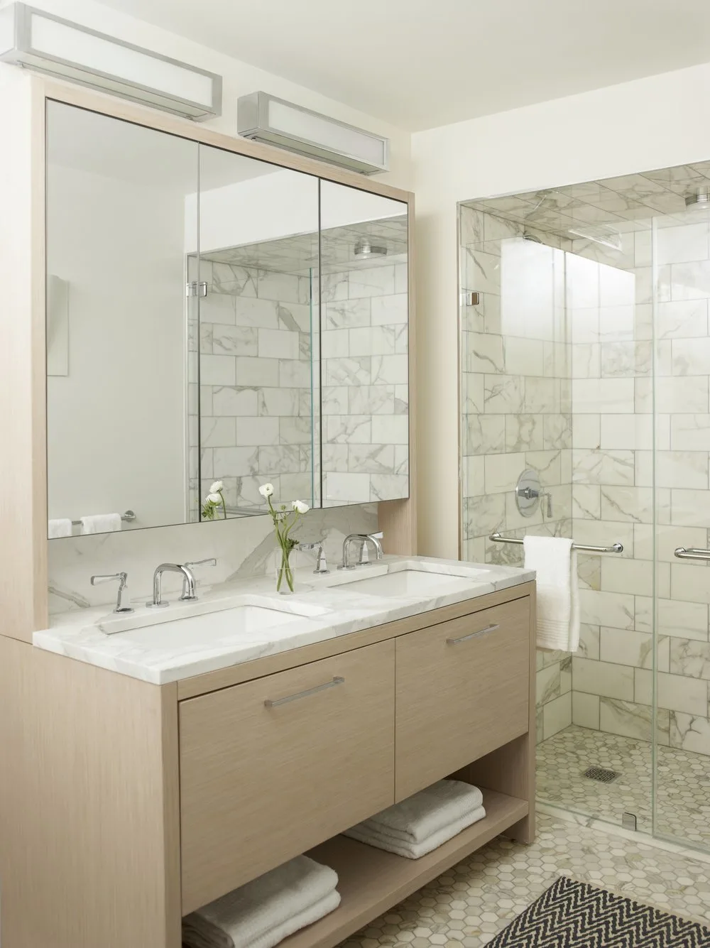 vanity, bathroom, marble, sinks,mirror, shower, towels, wood, rug, mosaic tiles