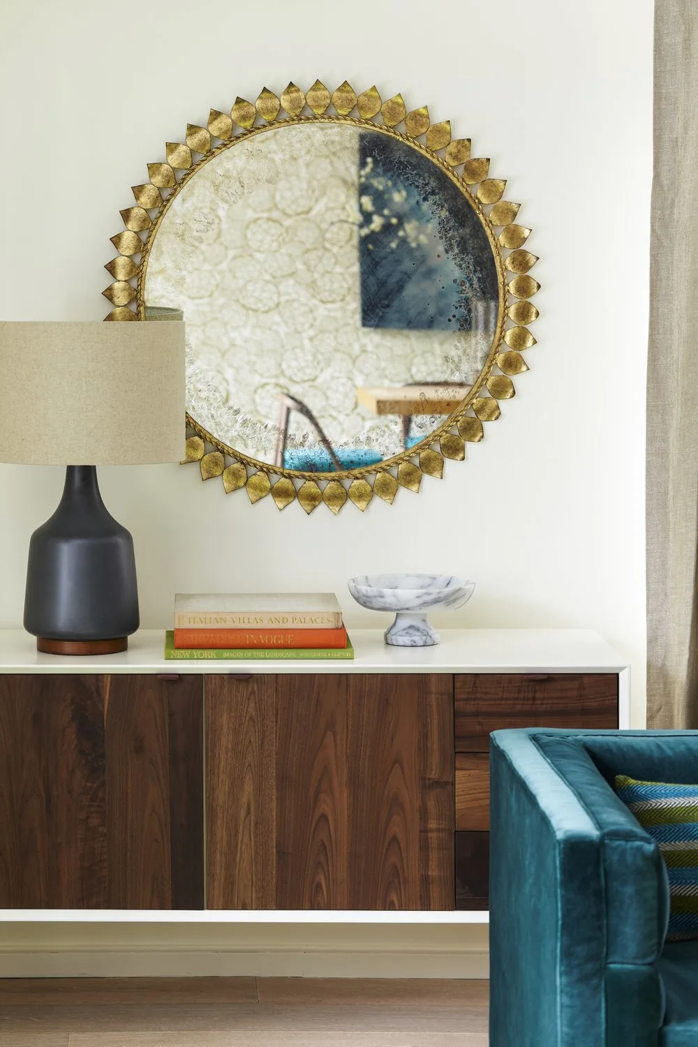 credenza, mirror, sofa, wood, books, pillow, frame,wallpaper, curtains, table lamp