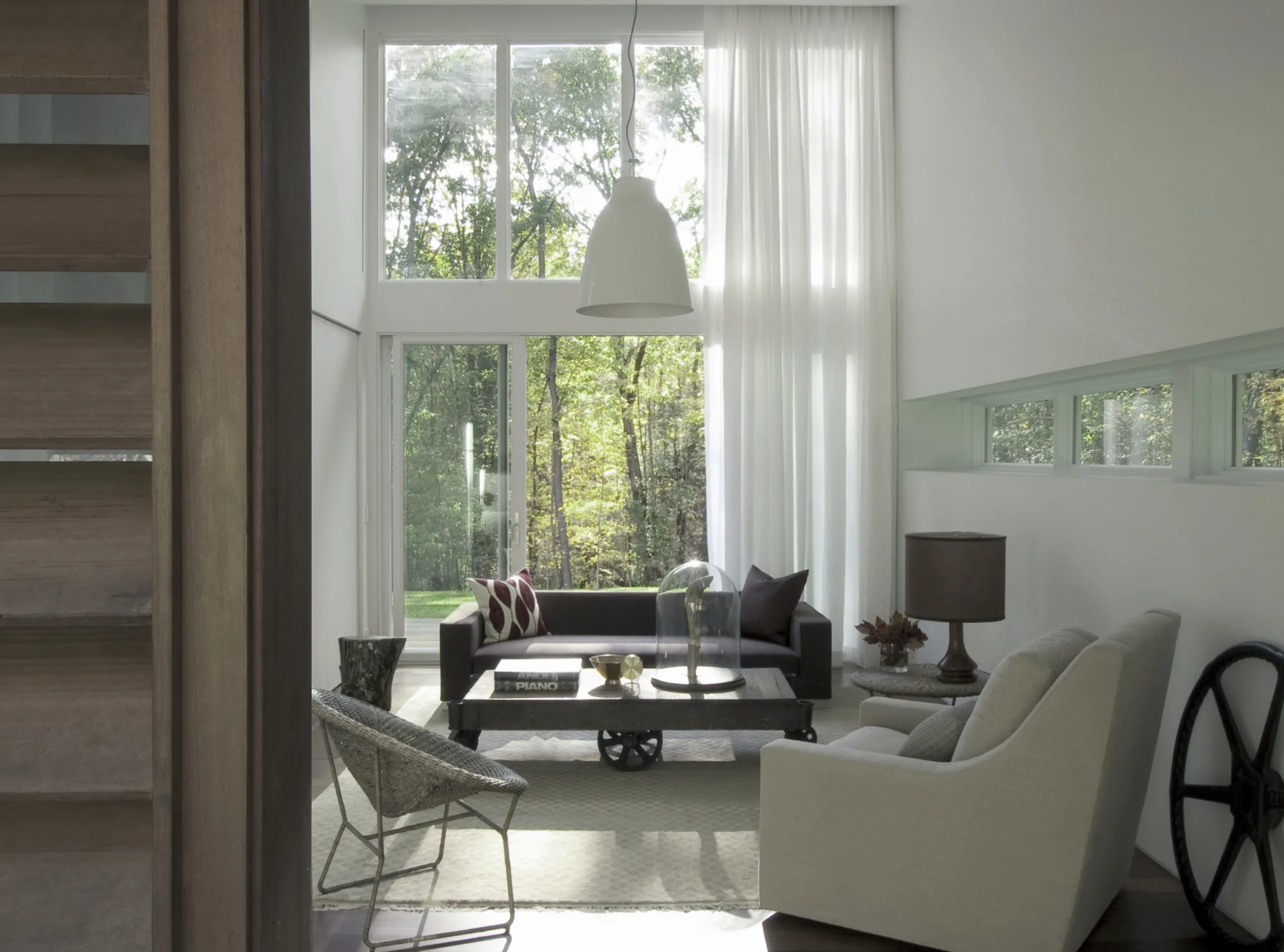SITTING area, sofa, chairs, windows, glass doors