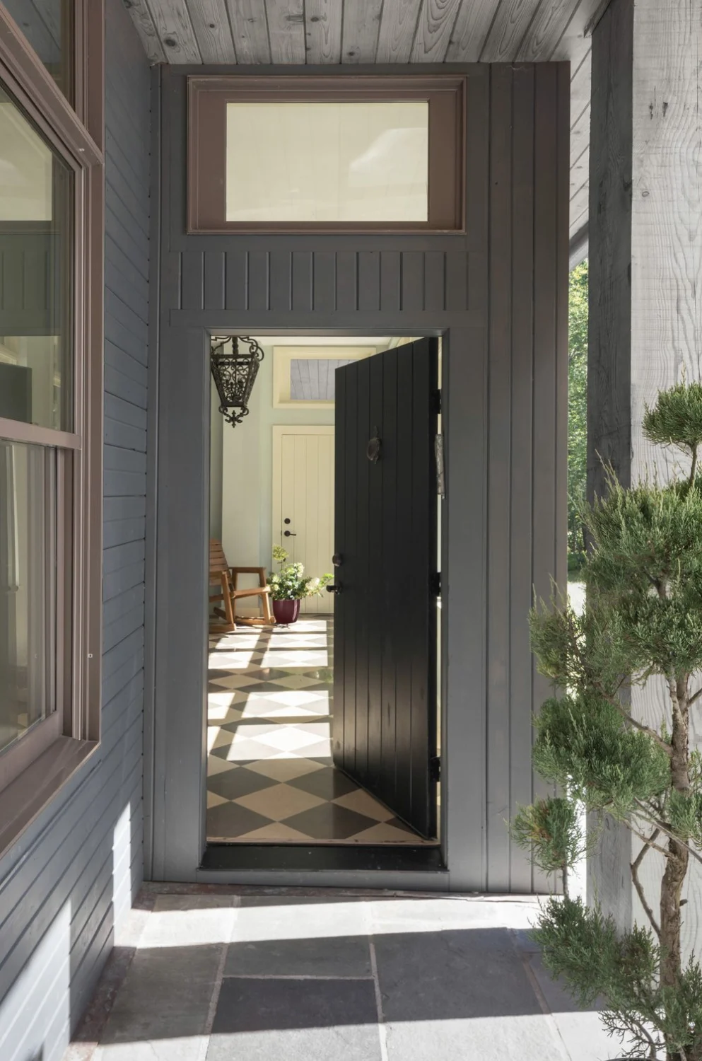 PORCH, entrance, door, tiles, gray, black and white, plant, hanging light, rocking chair, diagonal pattern, wood