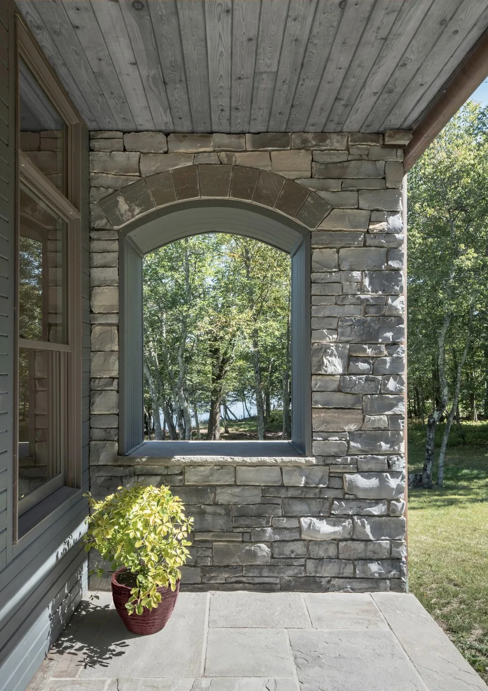 ARCHED WINDOW, stone, porch, wood, planter, trees