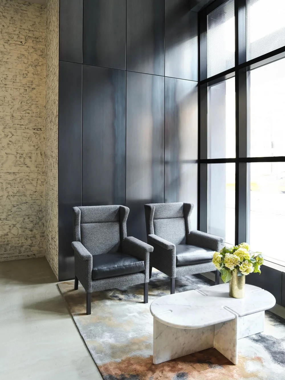LOBBY, seating area, carpet, metal, coffee table, flowers, glazing, brick