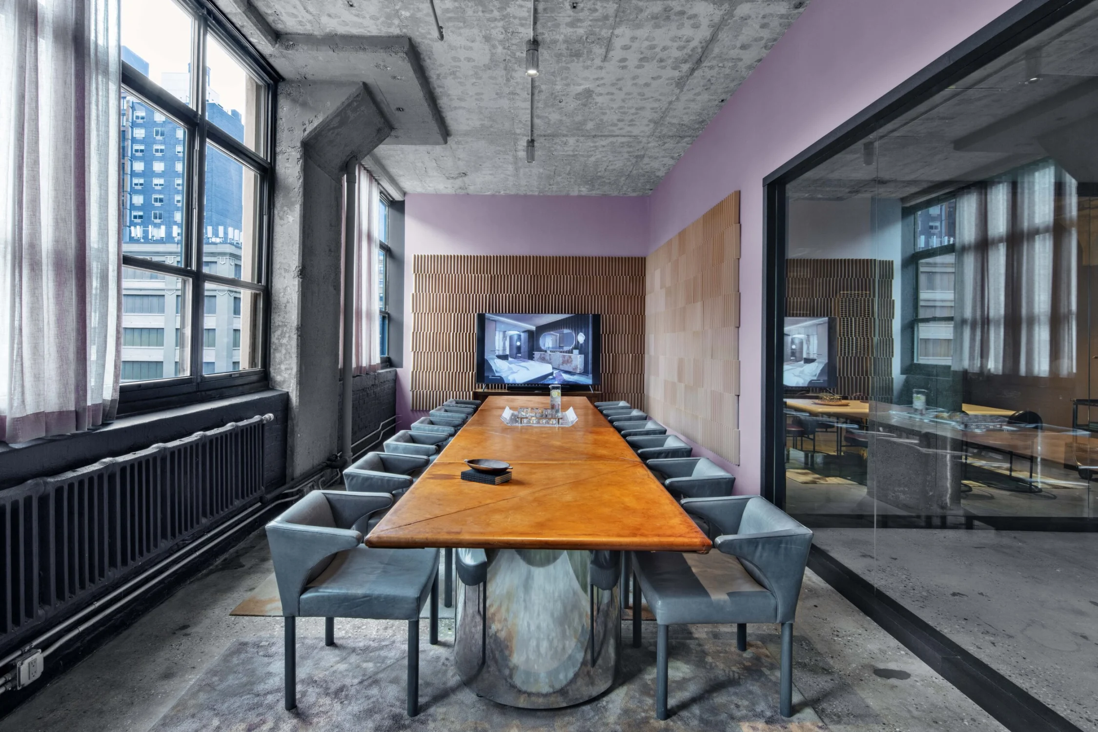 meeting room, table, television, leather chairs, concrete