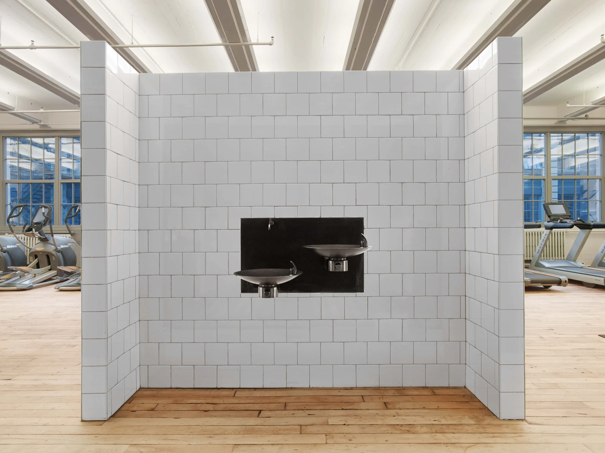 water fountain, white tiles, gym equipments, wood