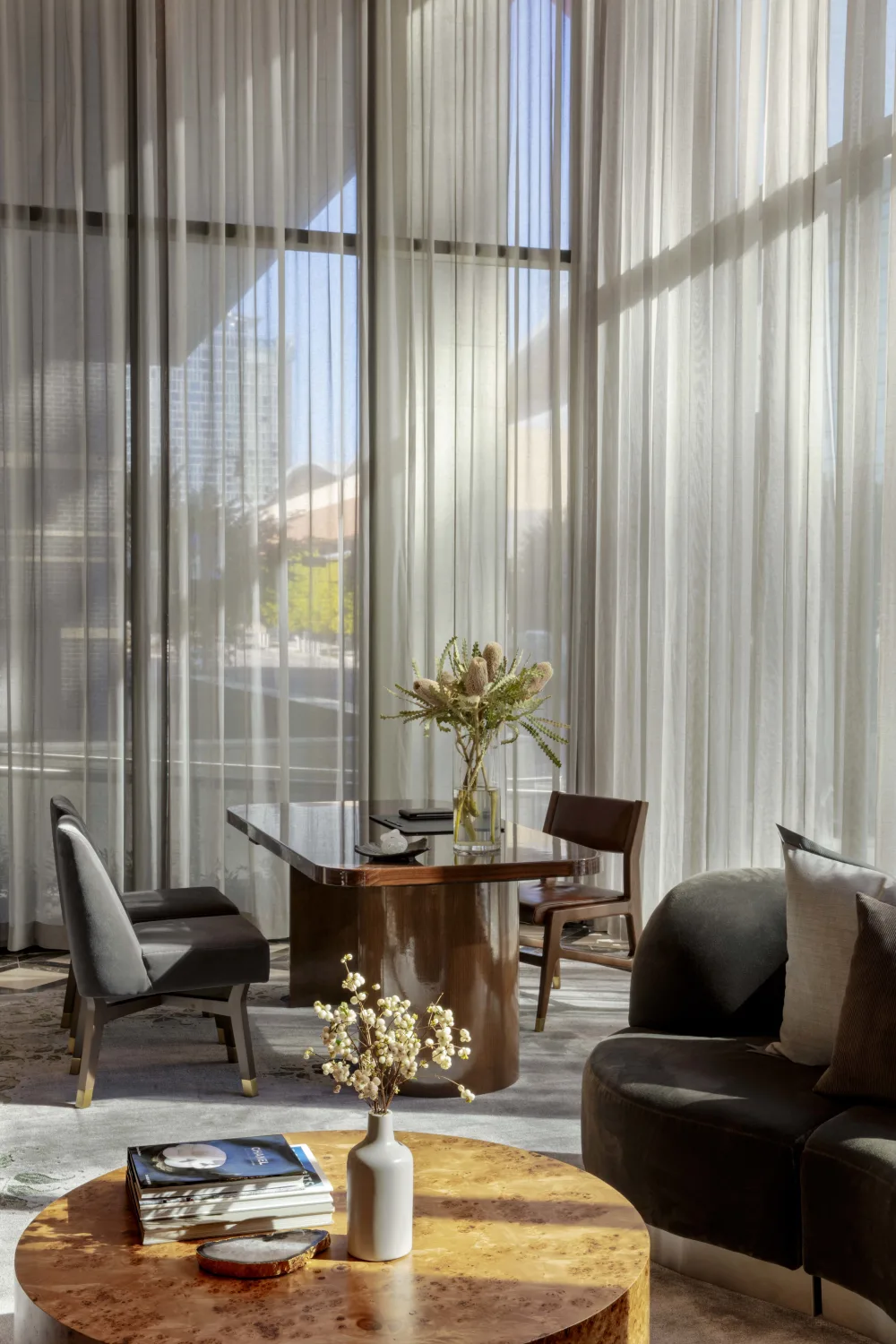 seatin area, table, chairs, lobby, curtains