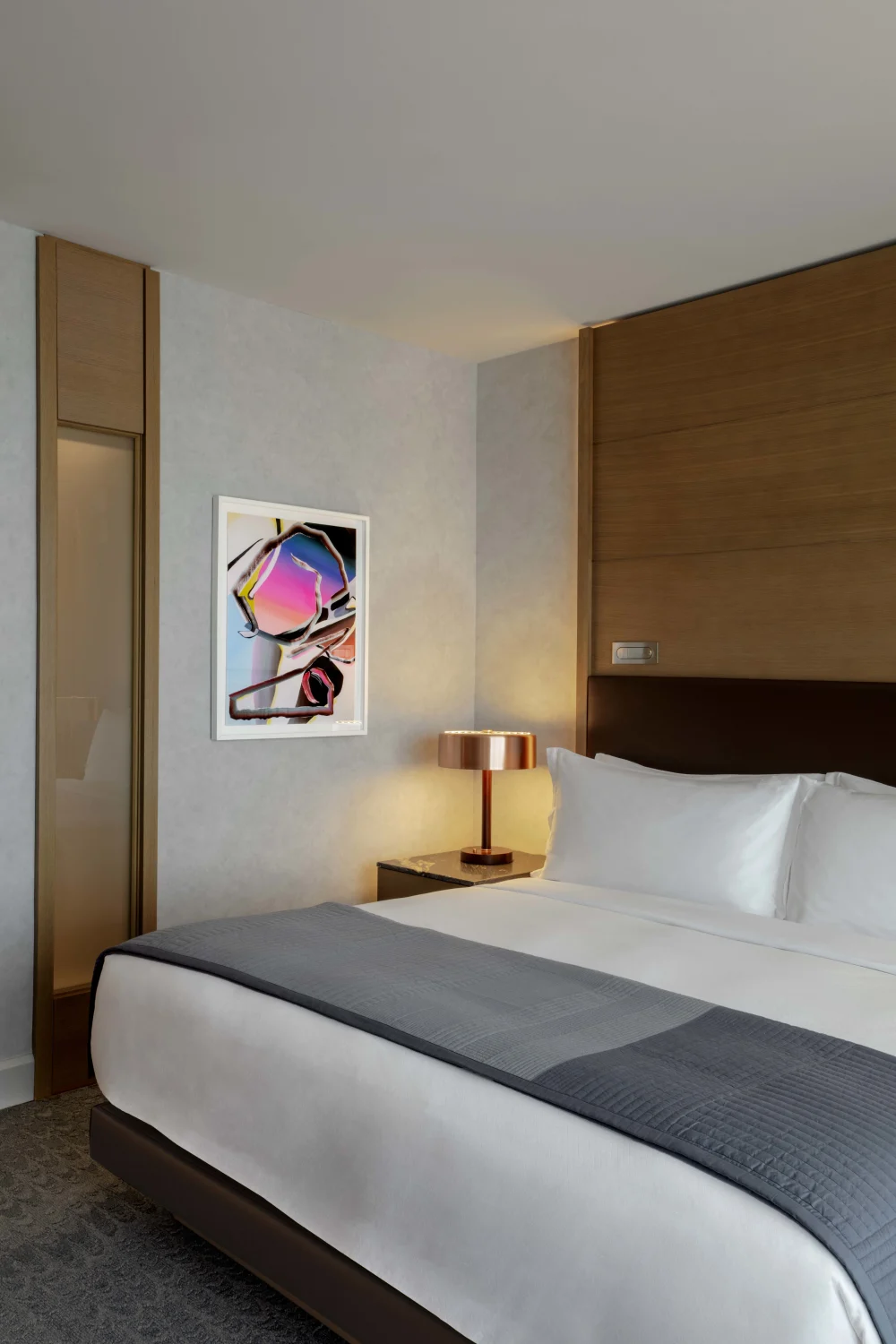 bed, art, side table, brass lamp