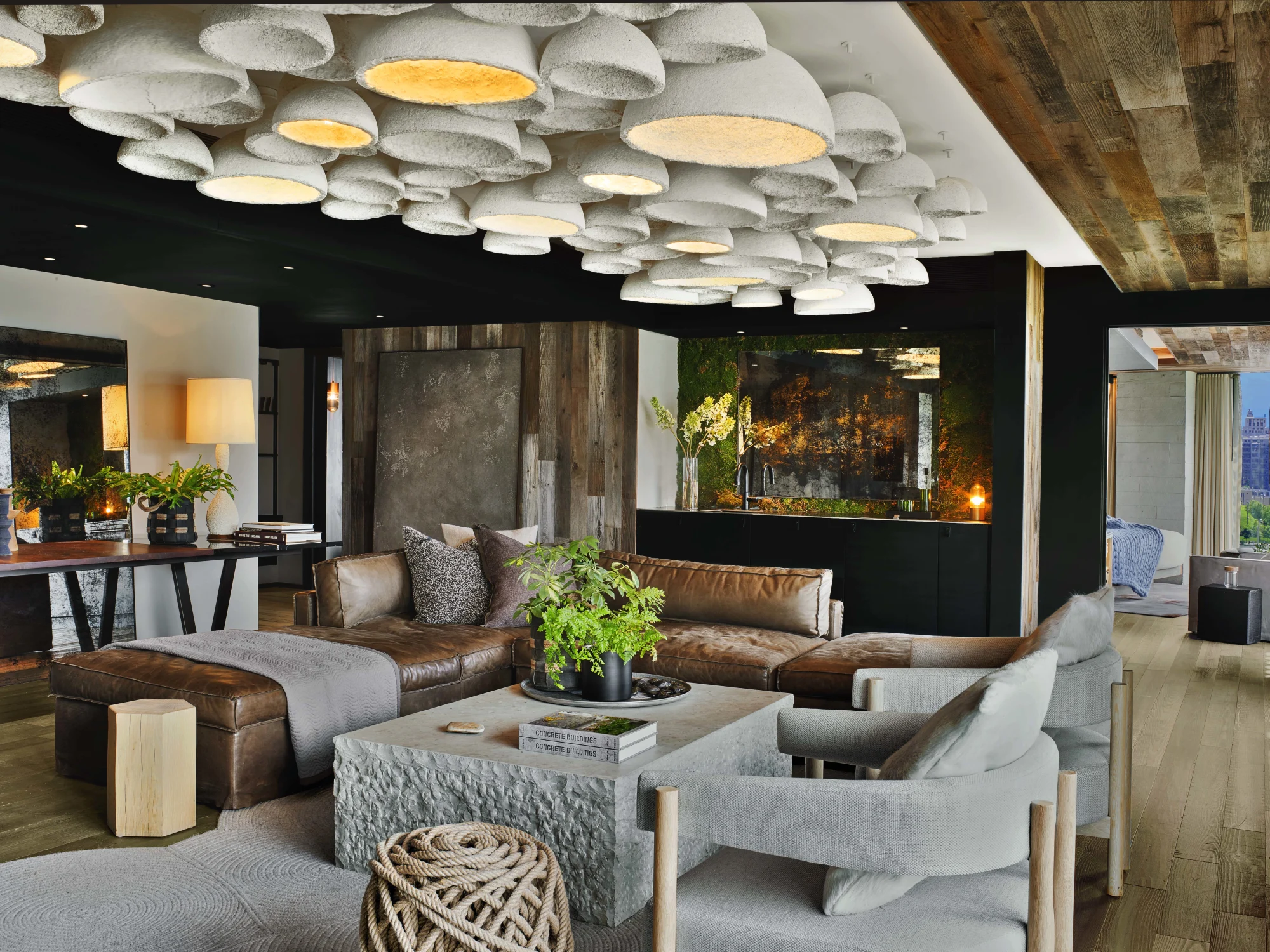 Pendant lights,  Lounge chairs,  Leather sofa , Stone table,  Greenery Wall, art,  Book,  Floor lamp ,Open space,  Wood