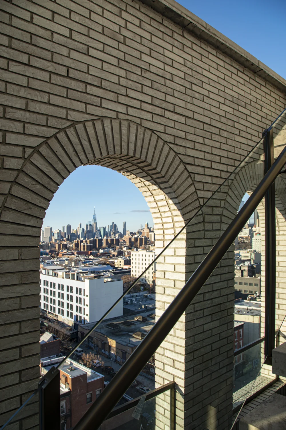 railing, skyline view, bricks, new york city