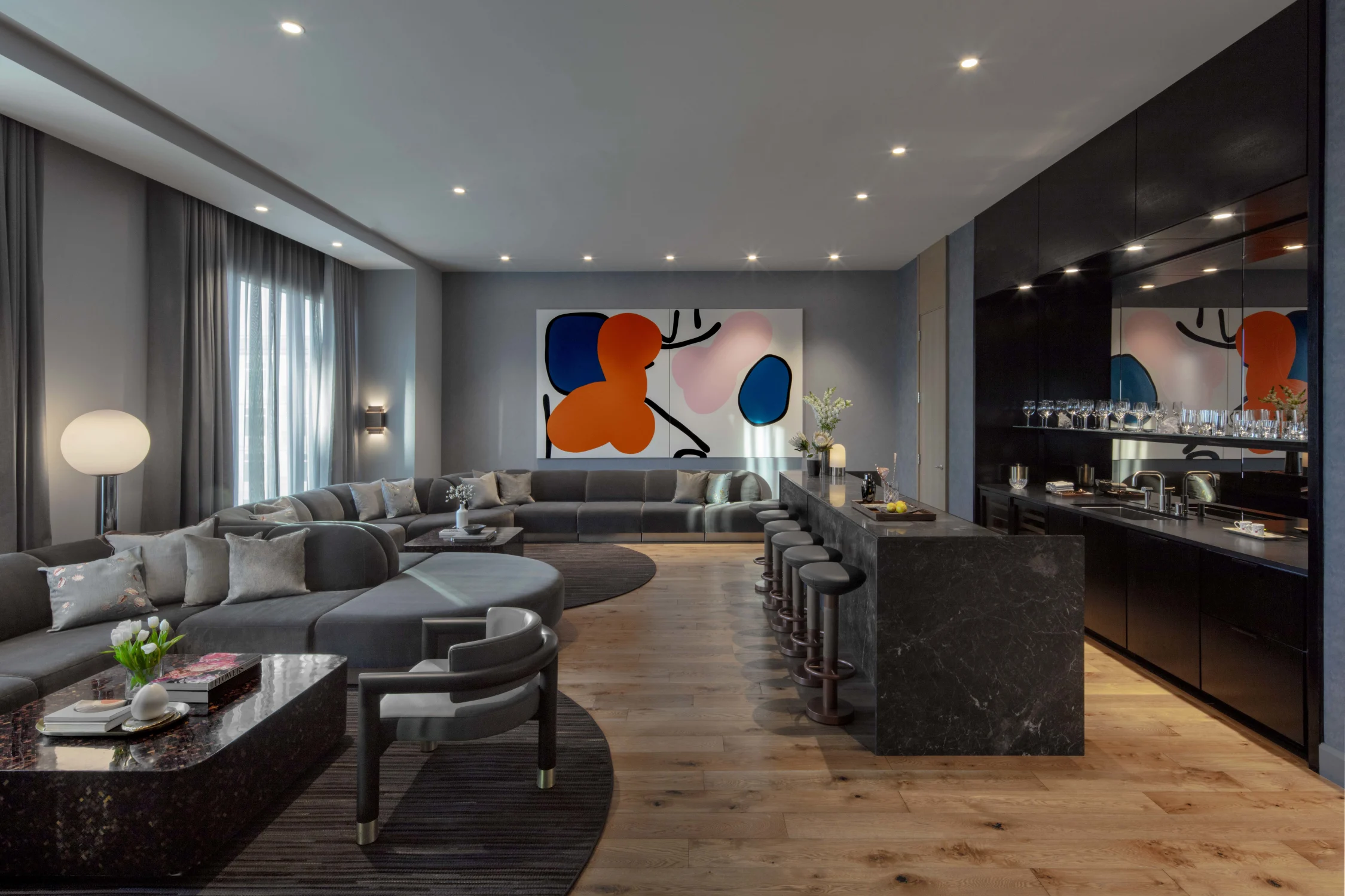 Bar, sectional, sofa, coffee tables, wood flooring