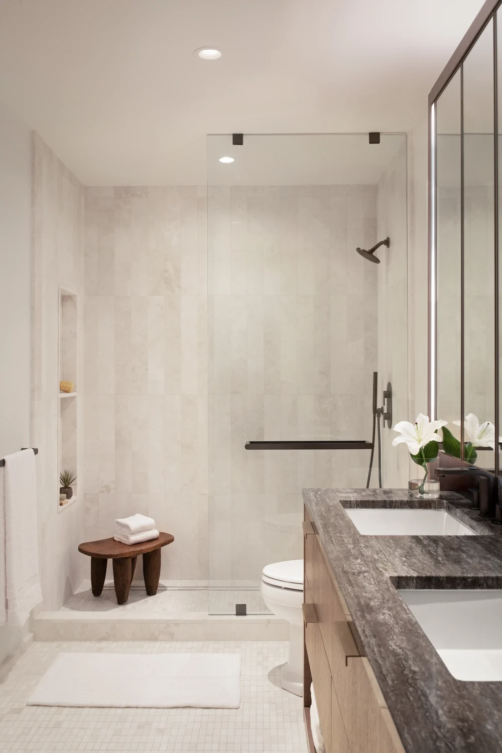 bathroom, marble, tile, sinks, shower, stone, flowers, niche, wood stool, mirror