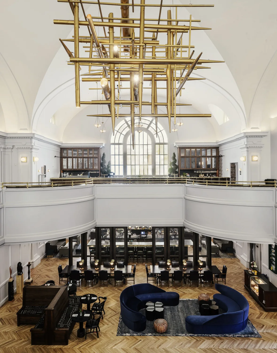 arched ceiling, gold chandelier, overhead, seating