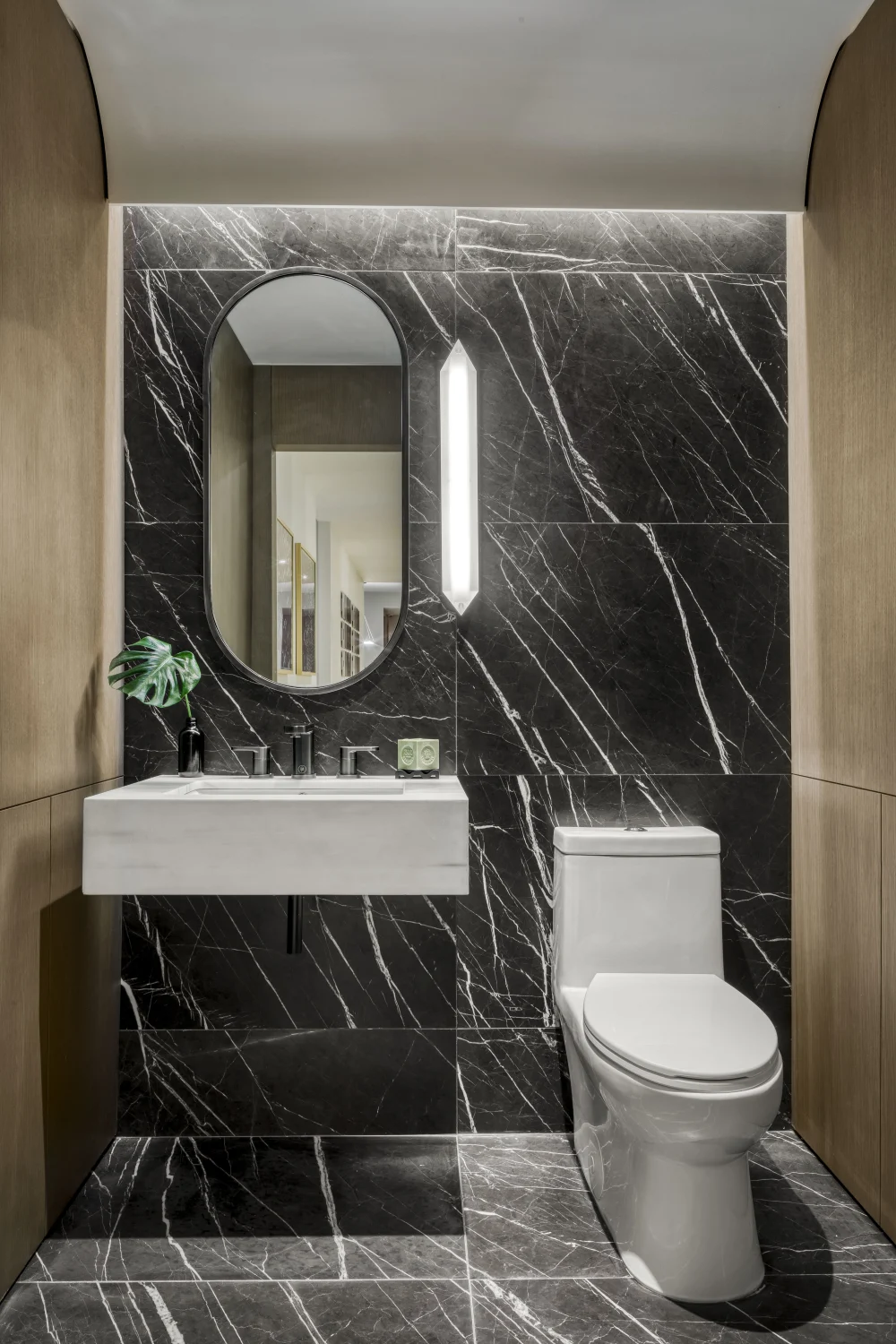 powder room, black marble, sink, mirror