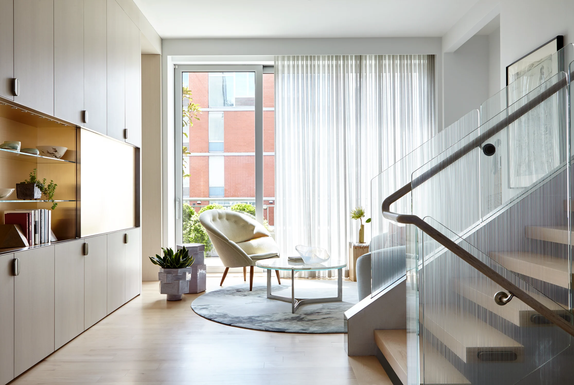 den, stairs, windows, cabinets, chair, carpet, glass, curtains, plants, coffee table