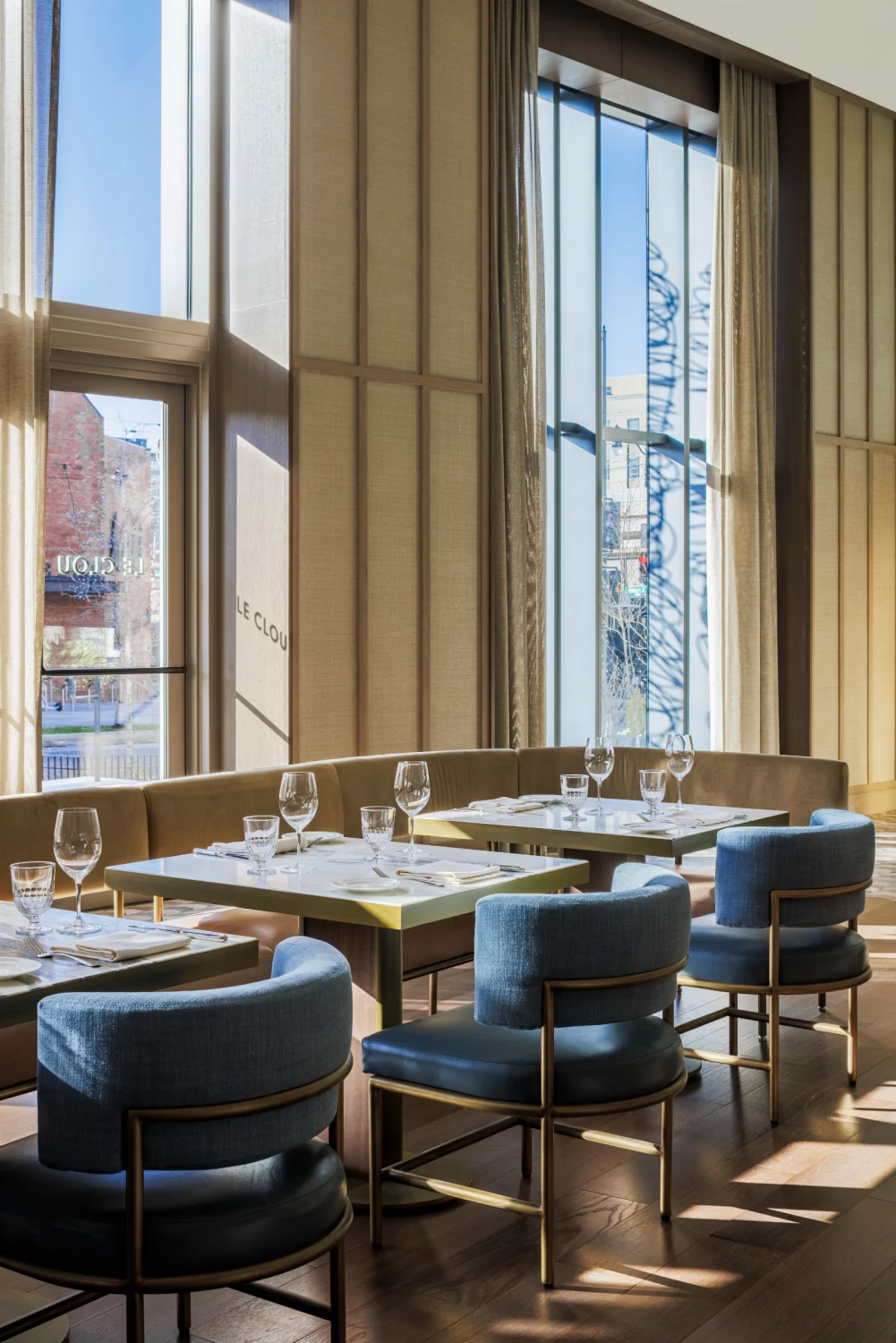 le clou, brass, dining, restaurant, banquette, chairs, tapestry, gold, glasses, wood flooring