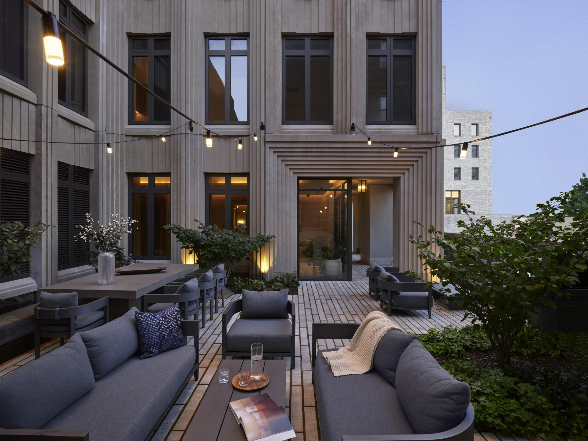 outdoor seating, lounge, patio, lighting, sofa, green, plants, wood