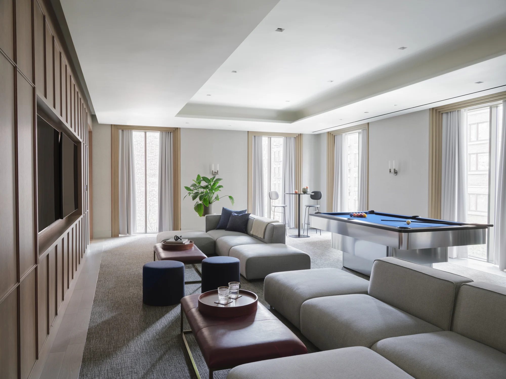 game room, lounge, sofa, billiards, television, wood panels, drapery